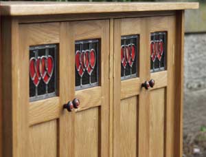 photo of oak sideboard with stained glass panels, £1200.00